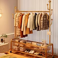 Bedroom Interior With Golden Clothes Rack Hanging Coats Storage Rack Folded Clothes And Plush Toy
