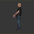 Bald Man In Black T-shirt And Blue Jeans Standing Against Gray Background