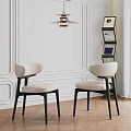 Modern Single Chair With Ivory Seat And Black Legs In White Paneled Interior Space