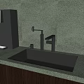 Black Kitchen Sink On Green Speckled Countertop With Modern Faucet And Fresh Fruits