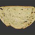 Artisan Bread Slice With Golden Crust And Airy Texture On Black Surface