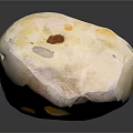 Natural Speckled Stone With Yellow Brown White Tones And Textured Surface