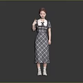 Stylish Woman With Red Hair Wearing Plaid Dress White Collar And White Shoes