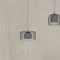 Modern Pendant Lights With Black Glass Shades And Metal Accents For Minimalist Interior