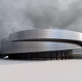 Modern Curved Museum Building With Metal Facade And Large Glass Windows Against Open Sky Background