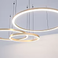 Modern Circular Chandelier Design With Illuminated Rings And Minimalist Metal Frame