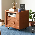 Wooden Storage Cabinet With Drawers On Wheels Topped With Radio Books Cup And Plant
