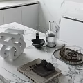 Decorative Ornament Set With White Spiral Sculpture Black Diffuser And Metal Tray On Marble Countertop