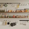 Organized Kitchen Spice Jars On Shelves With Hanging Utensils And Storage Containers