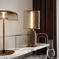 Modern Table Lamps With Textured Shade And Glass Cover On Marble Surface And Metal Stand