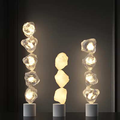 Three Modern Stacked Stone Like Floor Lamps Illuminated On Dark Background 3d model