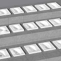 Multiple White Squat Toilets Neatly Arranged On Stepped Grey Tile Floor