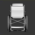 Modern Wheelchair With Gray Seat Metal Frame Armrests Footrests And Silver Wheels