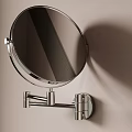 Circular Wall Mounted Mirror With Metal Stand On Light Colored Wall And Dark Stripes
