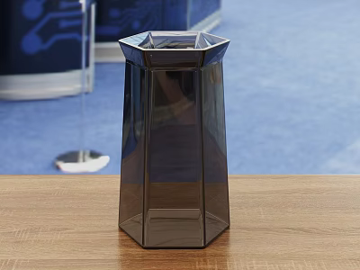 Modern Dark Glass Cup With Hexagonal Design On Wooden Table And Blue Carpet 3d model