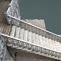 Decorative Stone Staircase With Ornate Metal Railings And Lattice Wall Design