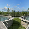 Modern Industrial Plant With Circular Tanks Metal Railings Green Grass Blue Sky And White Clouds