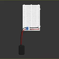 Black Power Supply Connected To White Circuit Board With Blue Component And Red Black Wires