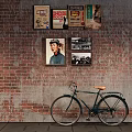 Vintage Bicycle Leaning Against Brick Wall With Retro Posters And