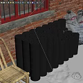 Black Cylindrical Blocks Stacked By Red Brick Wall With Bamboo Chair And Sacks