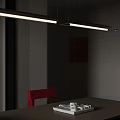 Modern Linear Pendant Light Hanging Over Wooden Table With Red Black Chairs And Wall Art