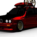 Shiny Red Car With Bicycle Mounted on Roof and Gold Alloy Rims