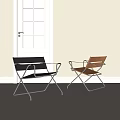 Two Modern Leisure Chairs With Black And Brown Seats And Metal Frames In Bright Interior
