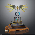 Futuristic Monument Design With Golden Wings Diamond Structure Blue Glowing Elements And Orange Gray Base