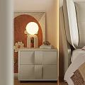 Modern Beige Nightstand With Round Lamp Books And Bedside Artwork