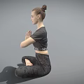 Woman Practicing Yoga in Seated Pose with Joined Hands and Black Activewear