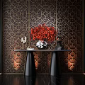 Modern Console Table with Red Floral Arrangement White Vase Candles Against Dark Geometric Patterned Wall