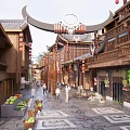 Traditional Chinese Commercial Street With Wooden Buildings Red Lanterns Stone Pavement And Pedestrians