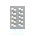 Pharmacy Medication Blister Pack with 10 White Capsules Arranged in Rows
