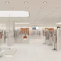 Modern Fashion Retail Counter In Shopping Mall With Mannequins Hanging Clothes And Bright
