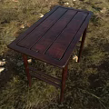 Dark Wooden Desk With Wooden Planks Top And Slim Legs On Grass Field