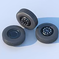 Black Rubber Tires With Three Wheel Rims And Visible Tread Patterns
