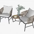 Wicker Chair and Table Set with Gray Cushions Small Round Table Green Plant and Books