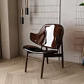 Modern Leisure Chair With Unique Design And Wooden Frame In Indoor Space With Green Plant