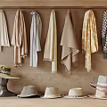 Daily Laundry Items Including Colorful Scarves And Hats Hanging On Wooden Wall