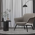 Beige Upholstered Leisure Chair With Small Round Side Table Green Plant And Floor Lamp