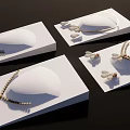 Elegant Pearl Jewelry Collection With Gold Necklaces Earrings On White Display Stands