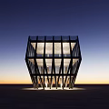Modern Commercial Complex with Geometric Glass Facade Illuminated at Twilight with Moon in Background
