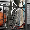 Sports Equipment Storage Rack With Various Balls Rackets Skateboard And Helmet