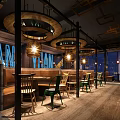 Industrial Style Restaurant Interior With Wooden Decor Pendant Lights And Colorful Chairs