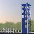 Industrial Training Tower With Blue Yellow Metal Structure Stairs Platforms And Surrounding Trees