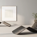 Modern Sculptural Chaise Lounge in Minimalist Interior with Framed Art and Potted Plant