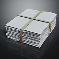 Organized Stack of Books and Magazines Tied with String on Dark Background