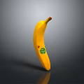 Fresh Yellow Banana Standing Upright on Black Surface with Green Sticker