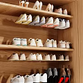 Variety Of Shoes Organized In Wooden Shoe Rack