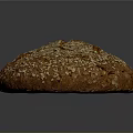 Freshly Baked Round Brown Bread With Oats And Seeds On Crusty Surface